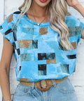 Geometric print blouse in sky blue with black and brown square blocks, crew neck, short sleeves