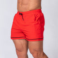 Red quick-dry sport shorts with elastic waistband and black drawstring, relaxed fit at back.