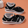 Women’s black mesh cross-strap flat sandals with white platform and black straps
