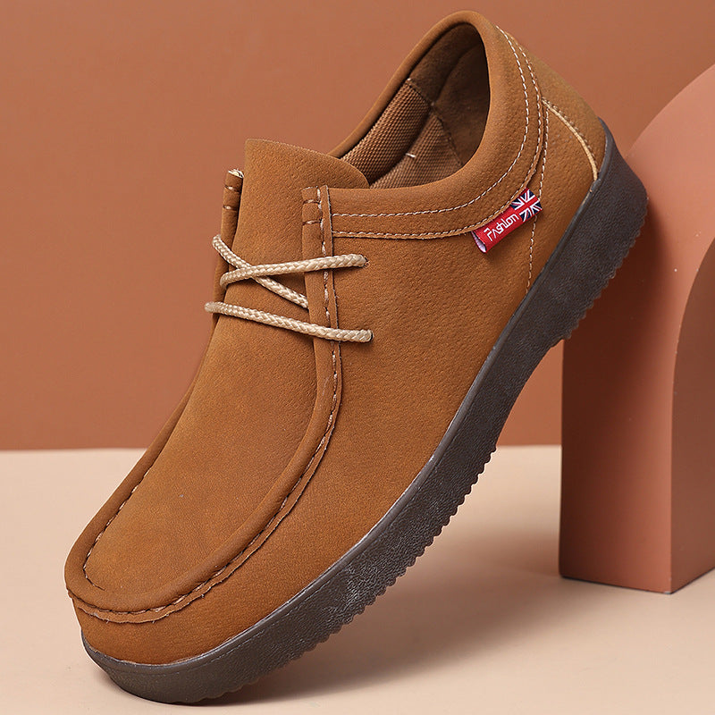 Brown suede low-top lace-up loafer with dark rubber sole and stitched moccasin toe.
