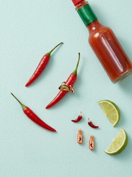 Red chili pepper and hot sauce bottle stud earrings with gold-tone posts