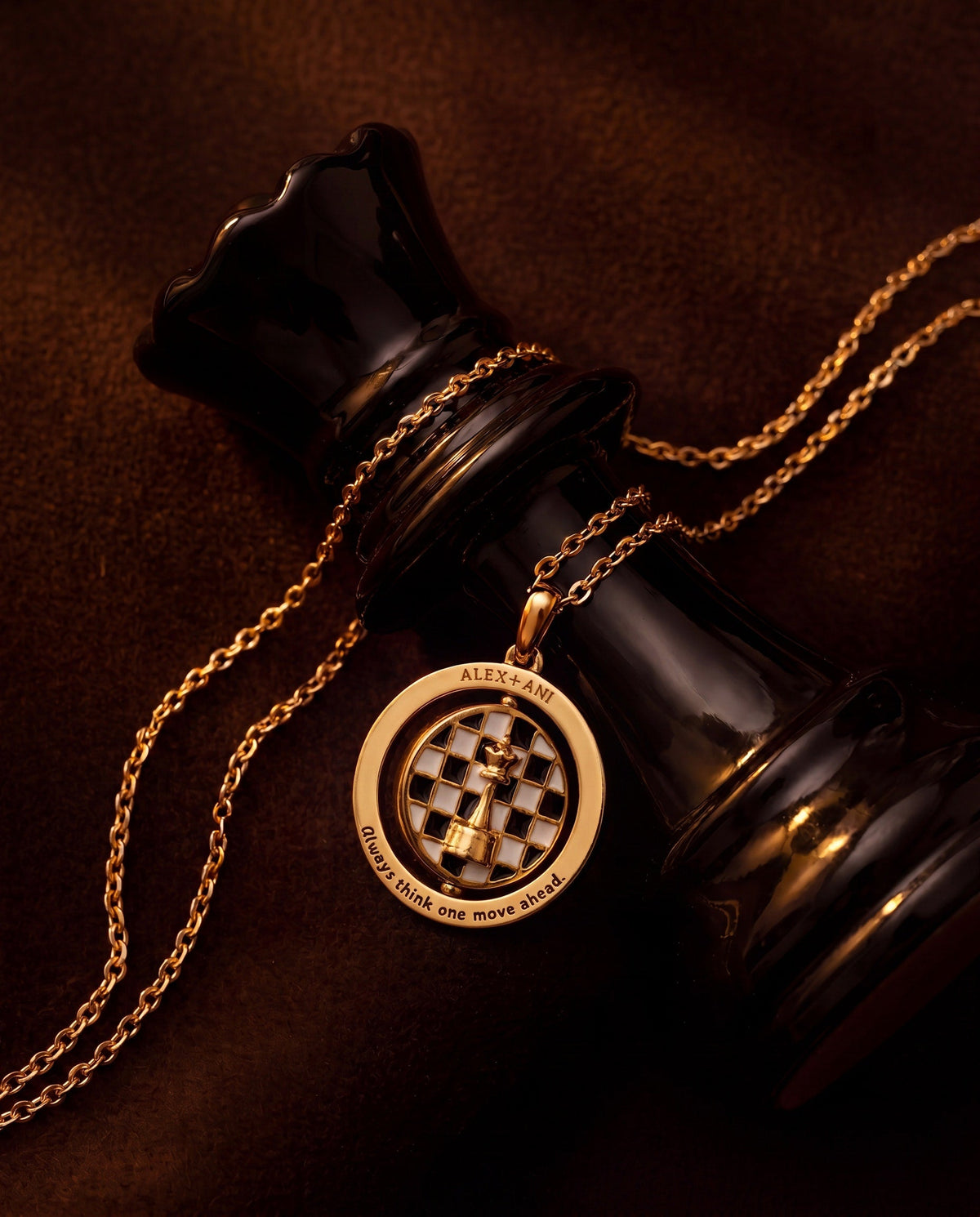 Gold round chess pendant on chain, engraved chessboard motif with text around rim