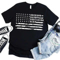Black crewneck T-shirt with star flag stripes and 'Husband Daddy Protector Hero' print.