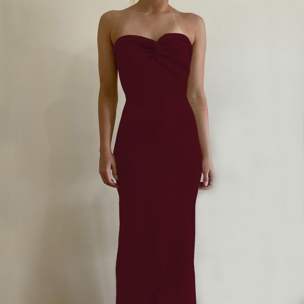 Off-shoulder knit wrap dress in deep wine/burgundy with knotted neckline, long silhouette