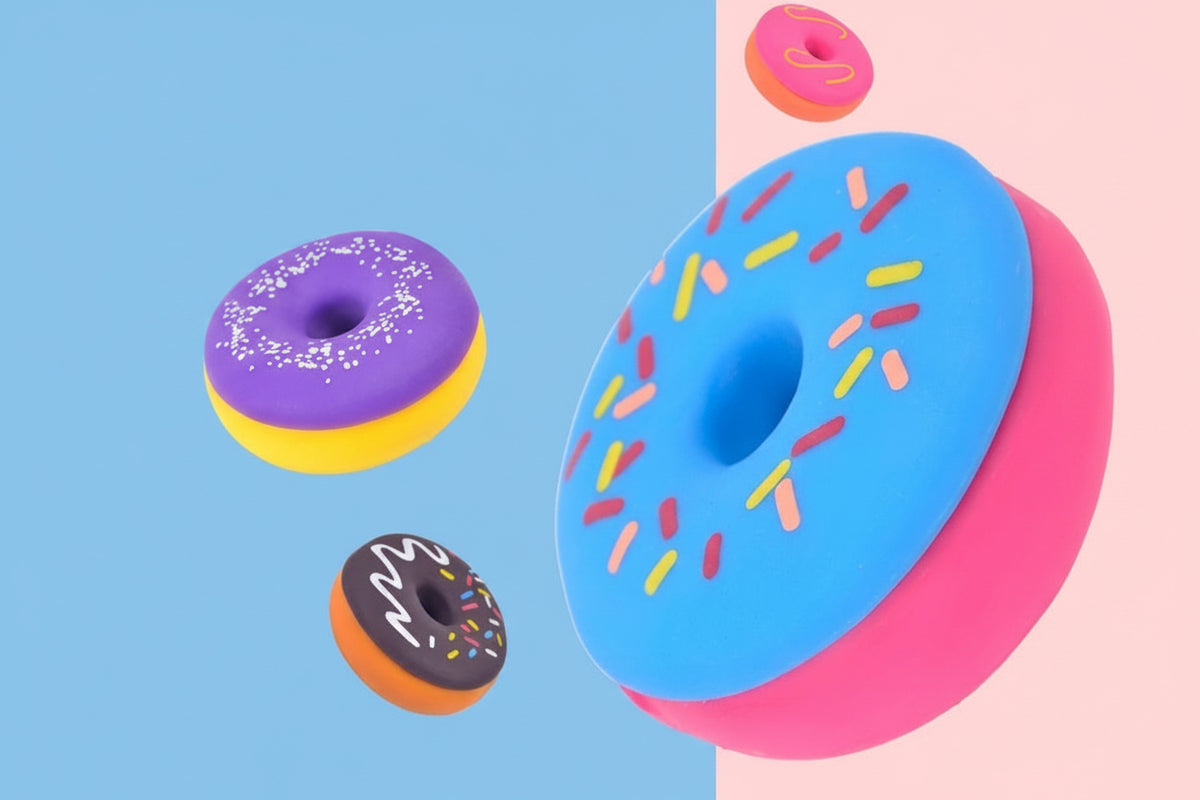Squishy donut stress-relief toy set, blue sprinkle and pink sides with assorted donut shapes