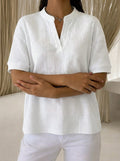 White waffle-knit short-sleeve blouse with V-neck and relaxed fit