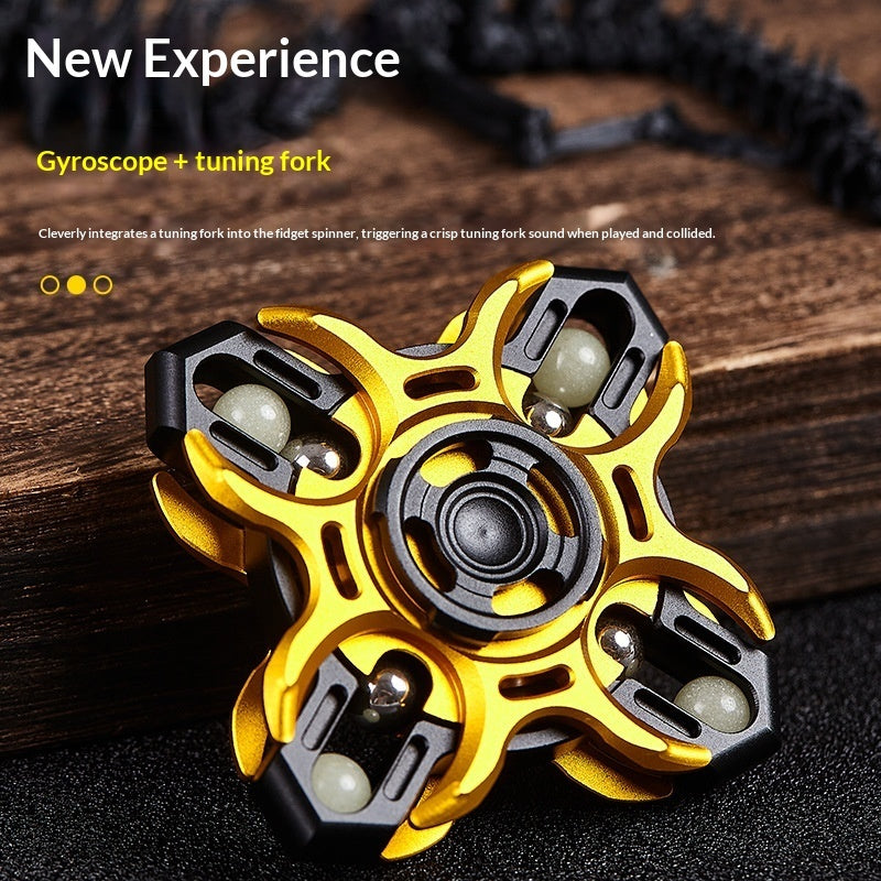 Gold and black aluminum fidget spinner with central disc and claw-like edges