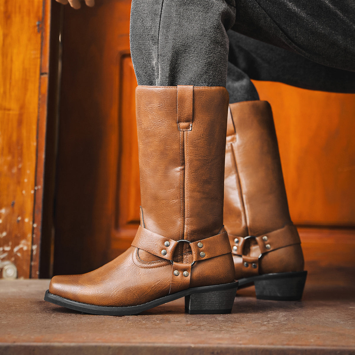 Light brown cowboy boots with square toe, chunky heel, slip-on shaft and buckle.