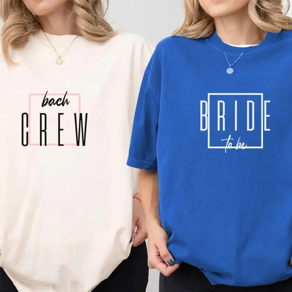 Two crewneck T-shirts: cream “bach CREW” and blue “BRIDE to be” front prints