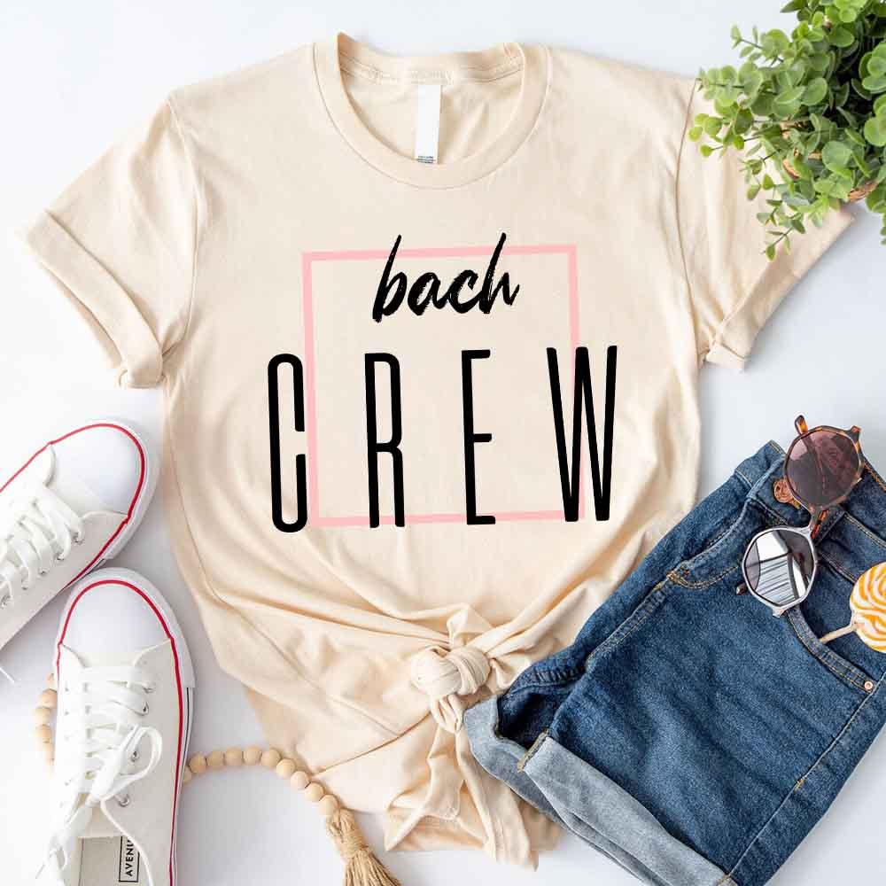 Cream crewneck T-shirt with 'bach' script and 'OREW' graphic in black
