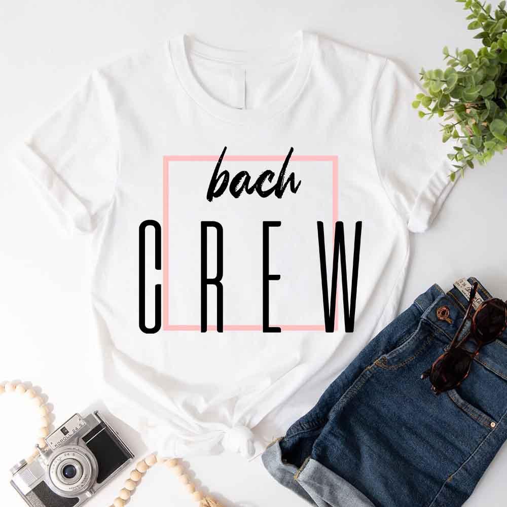 White crewneck T-shirt with 'bach' script and 'OREW' graphic in black
