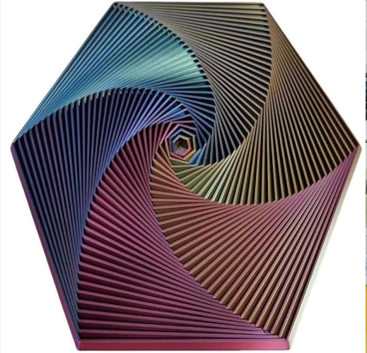 Hexagon sensory fidget toy with multicolor spiral ridges and a small concentric core.