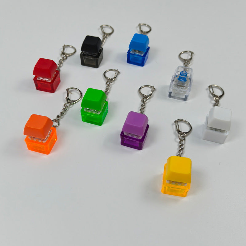 Cube stress-relief keychain toy with finger-popping buttons, assorted colors