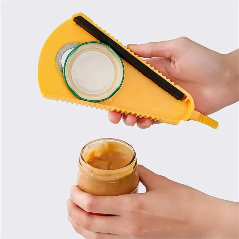 Yellow opener held above bottle; black blade and can-grip ring visible