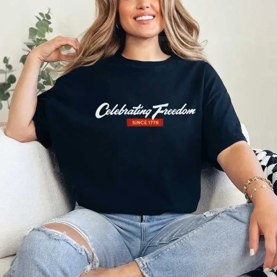 Dark navy graphic t-shirt with “Celebrating Freedom” and “Since 1776” print