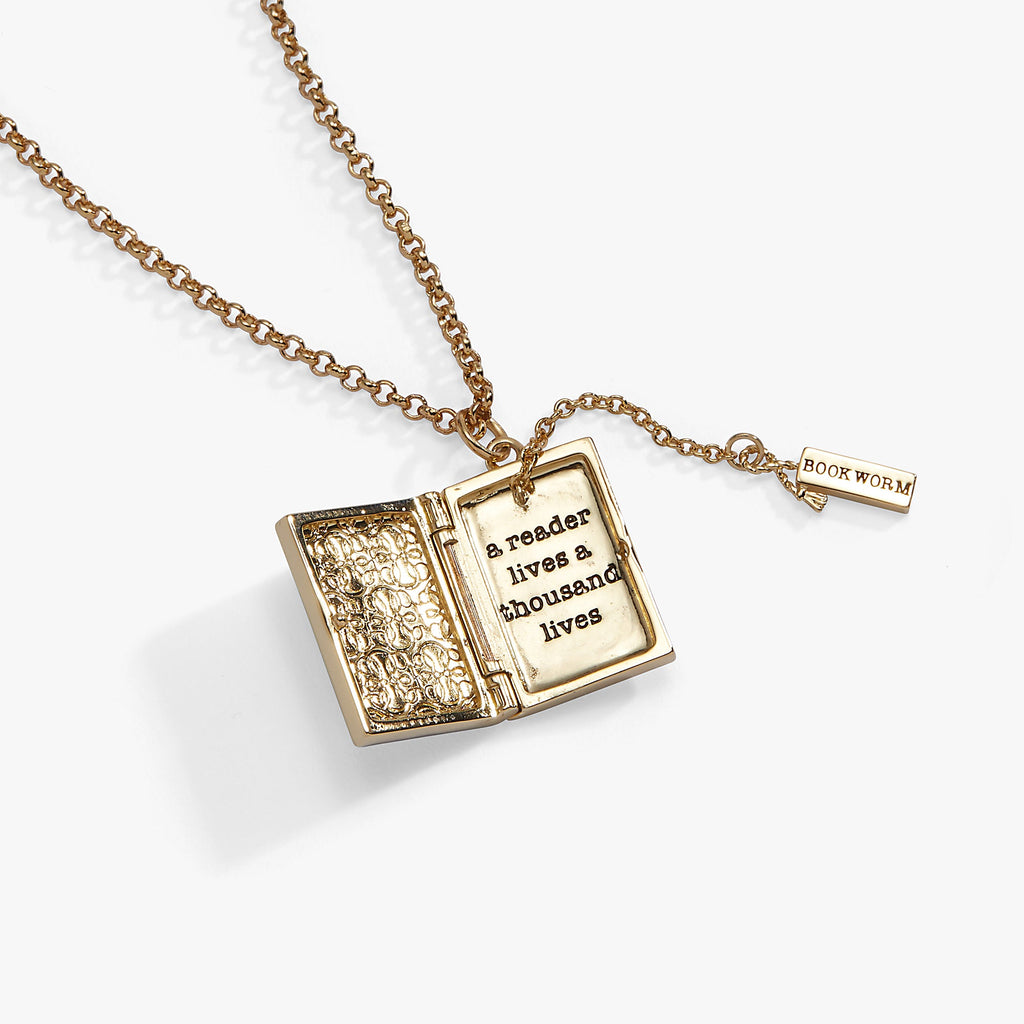 Gold open-book locket pendant with chain and small “BOOK WORM” tag