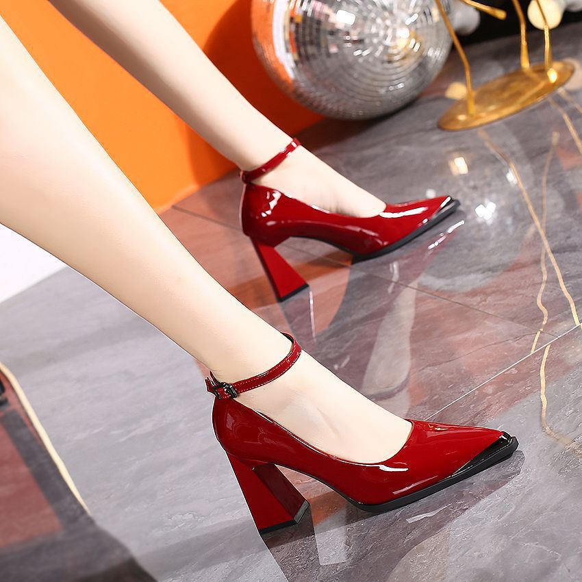 Red patent slingback pumps with pointed toe, ankle strap, and block heel