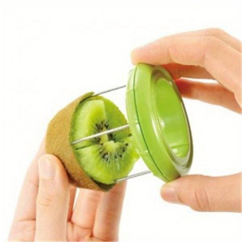 Green kiwi peeler and splitter tool held over a kiwi