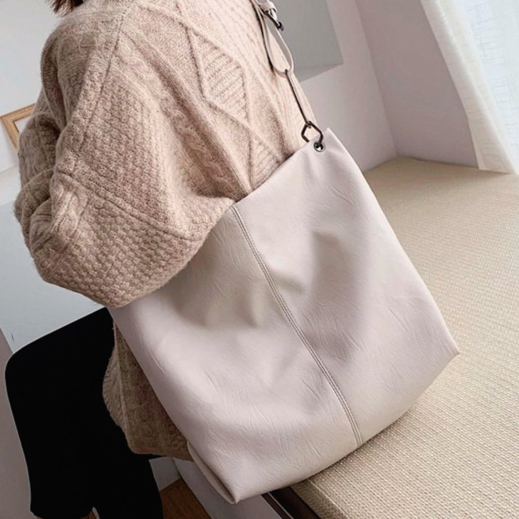 Light ivory shoulder bag with long strap and stitched front panel