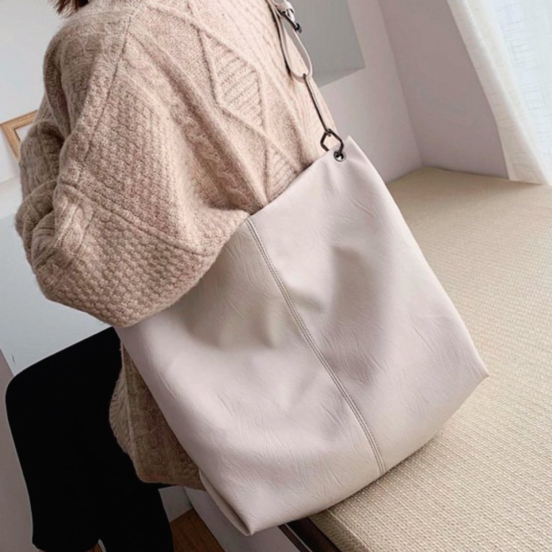 Light ivory shoulder bag with long strap and stitched front panel