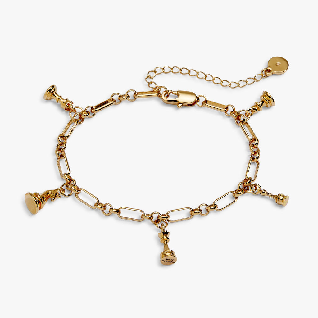 Gold chess charm bracelet with dangling chess-piece and coin charms on a chain