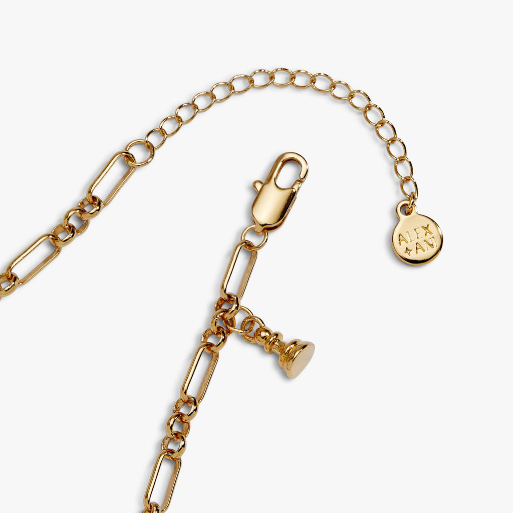 Gold charm bracelet with padlock clasp and round tag charm