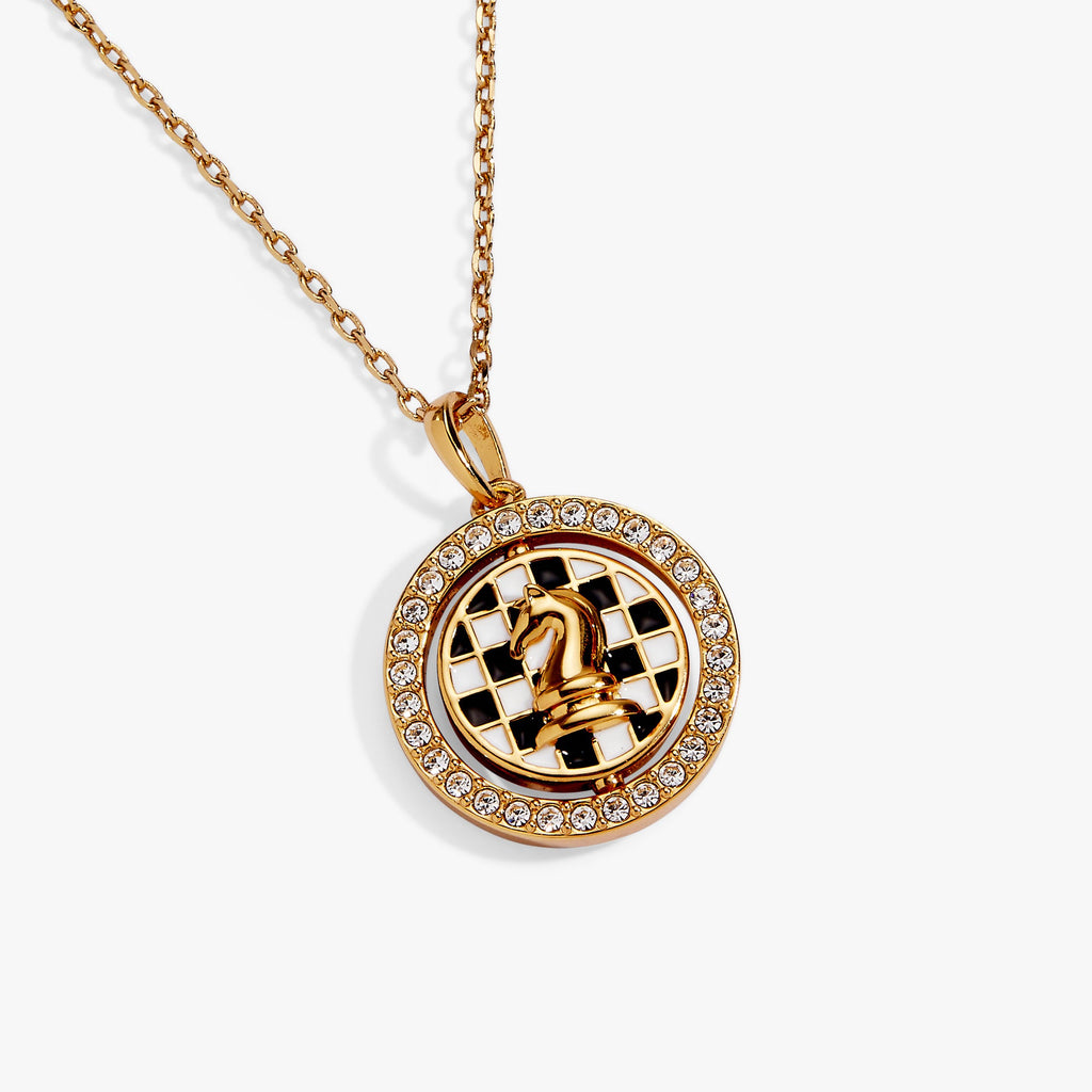 Gold round chess spinner pendant with checkered chessboard center and crystal halo