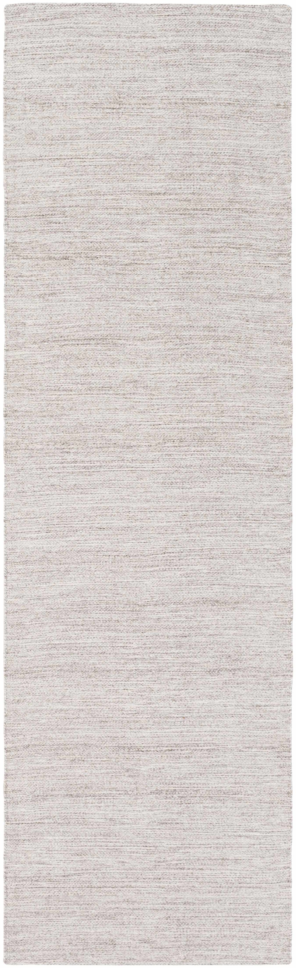 Rectangular runner rug with a subtle pattern on a plain background