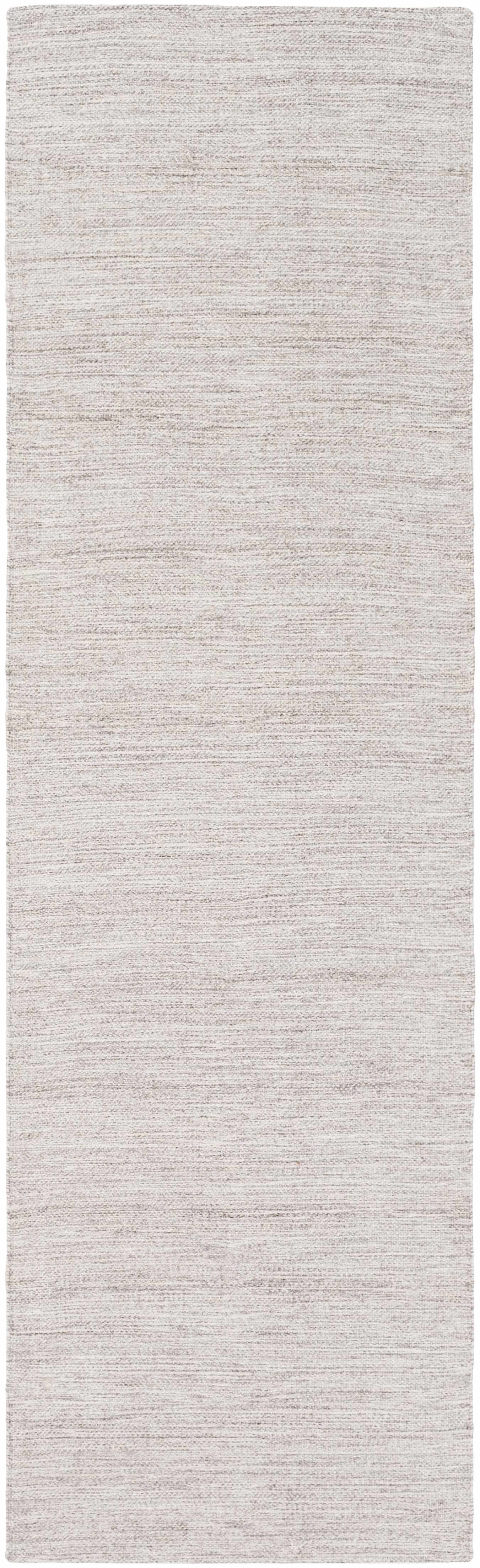 Rectangular runner rug with a subtle pattern on a plain background