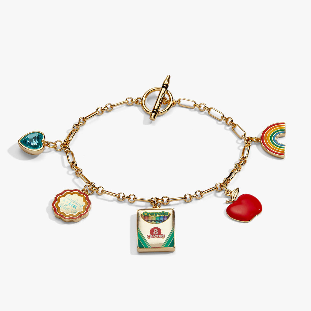 Gold toggle bracelet with rainbow, red heart, apple, and crayon book charms