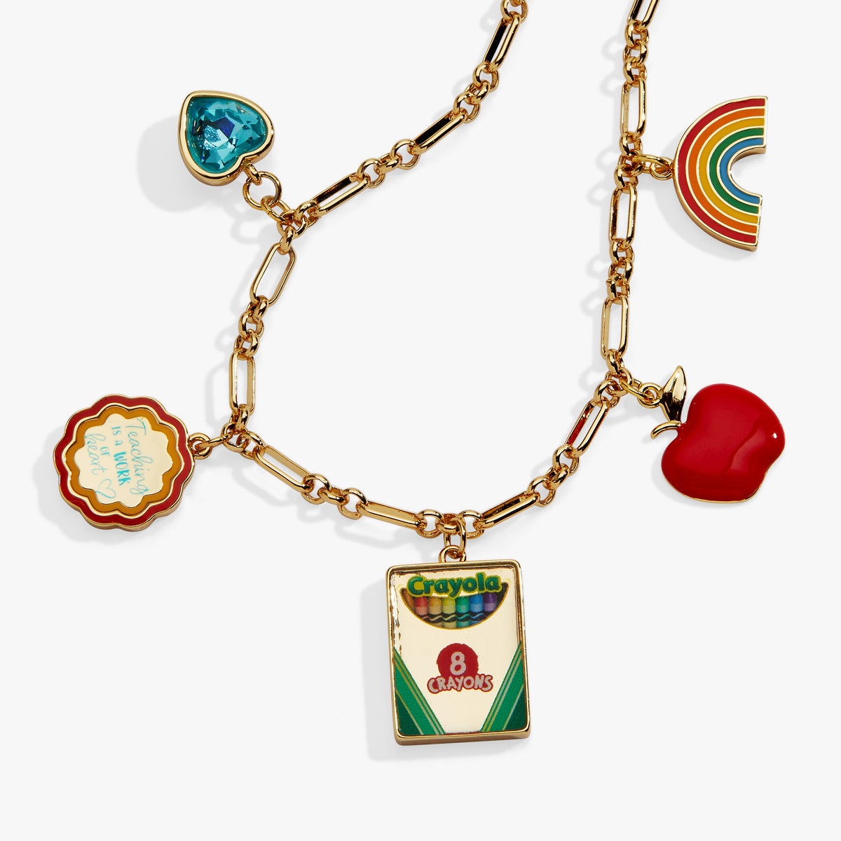 Gold chain toggle bracelet with turquoise gem, rainbow, red heart, apple, and crayon pack