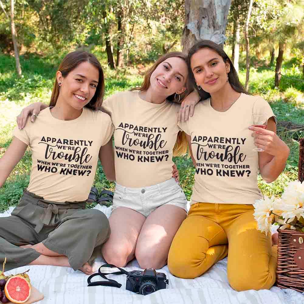 Beige bachelorette party T-shirts with 'Apparently we're trouble' matching front prints