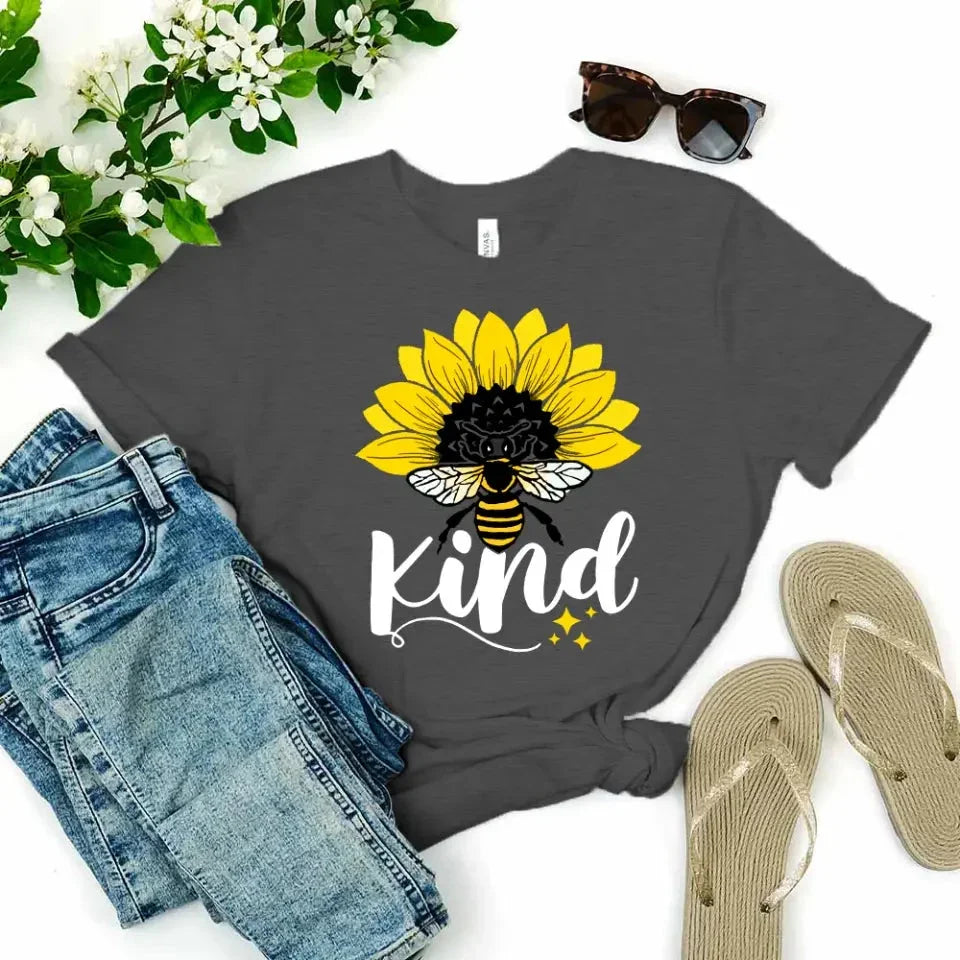 Dark grey T-shirt with sunflower, bee, and “kind” graphic on the front.