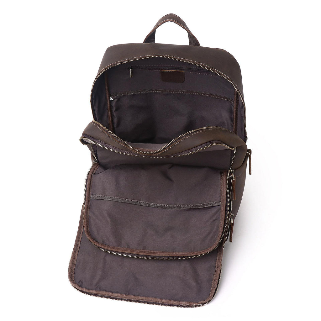 Coffee-brown leather backpack with front zip compartment and small outer pocket
