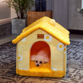 Yellow pet cave house with plush roof, curved front doorway, and small window details
