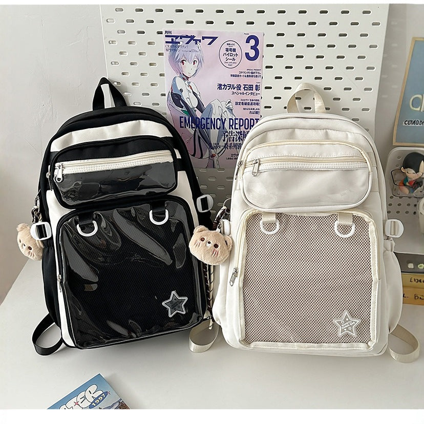 Large capacity black nylon backpack with front zip pocket and star patch detail
