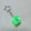 Green cube mechanical keyboard stress-relief keychain with star charm and metal chain