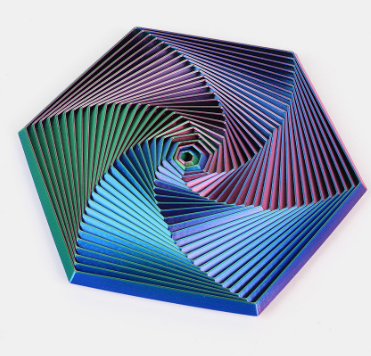 Hexagon sensory fidget toy with multicolor spiral ridges and a small concentric core.