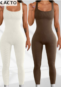 White and coffee brown sleeveless spandex workout bodysuits, fitted one-piece tanks.