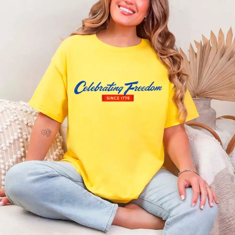 Yellow graphic t-shirt with “Celebrating Freedom” and “Since 1776” print