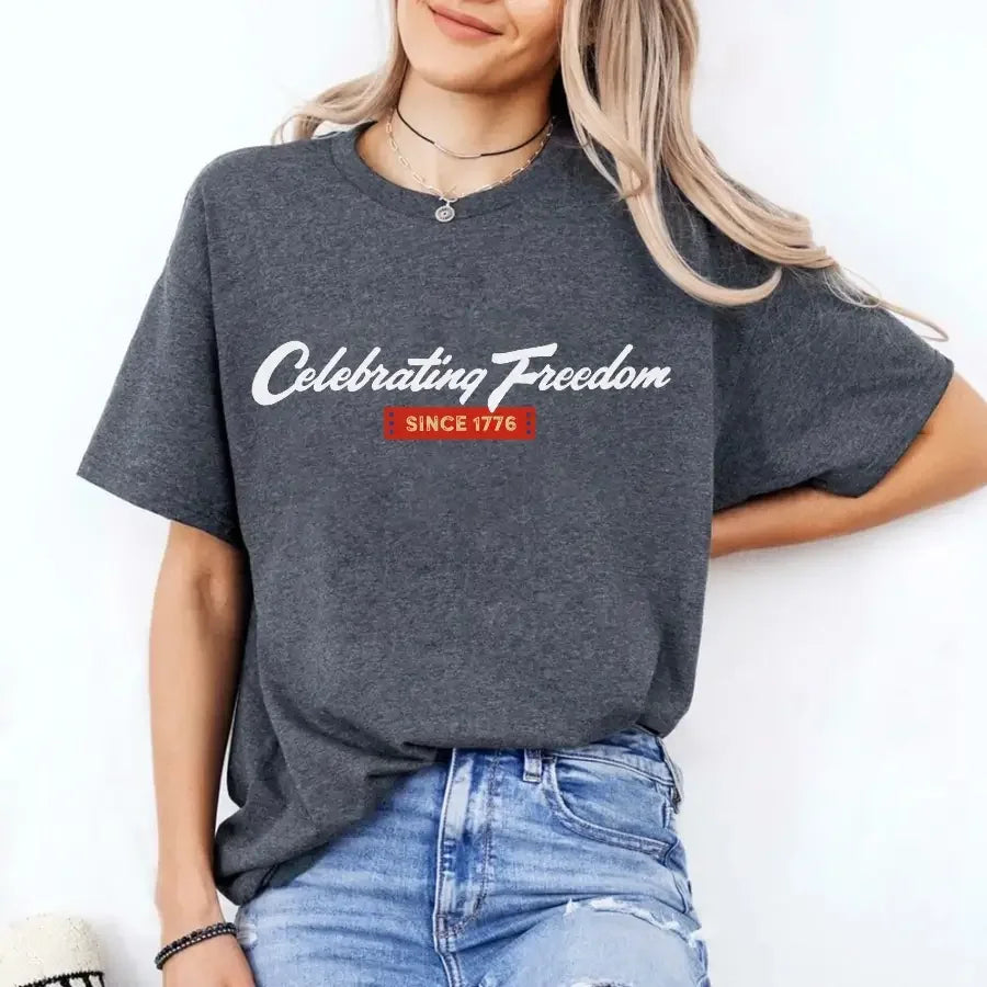 Charcoal gray graphic t-shirt with “Celebrating Freedom” and “Since 1776” print