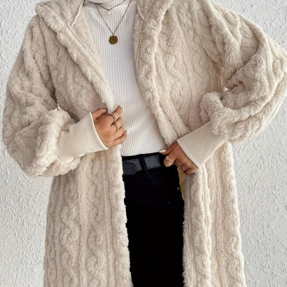 Hooded long plush coat in milky white, front pockets and oversized fuzzy cuffs.