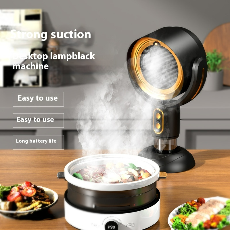 Portable desktop range hood smoke remover in black with glowing ring, steam rising