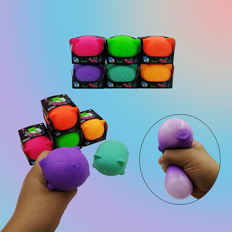Cat-shaped stress relief venting balls with a hand holding a purple one