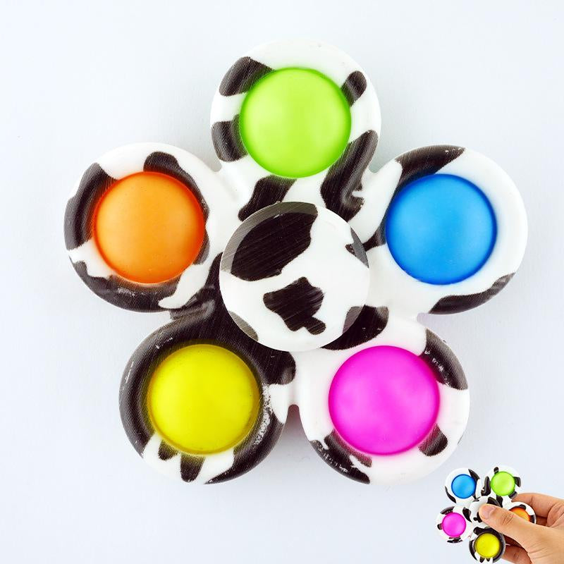 White fidget spinner with six multicolor printed button tips in green, orange, blue, yellow, pink.