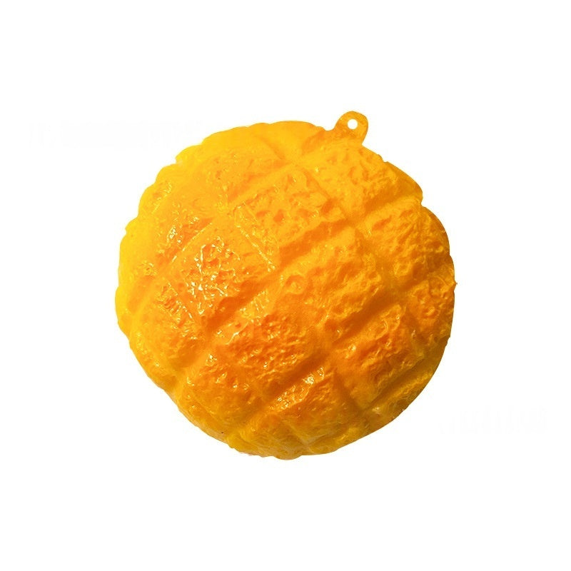 Orange pineapple bun stress relief squishy toy with small top loop, isolated