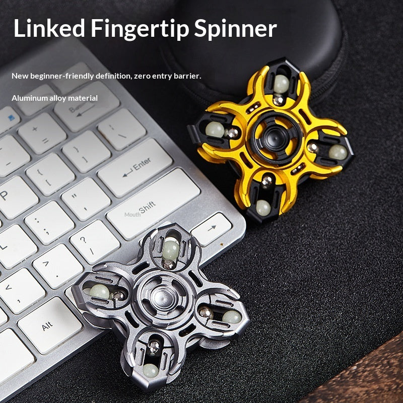 Gold and black metal fidget spinner with three rotating arms and central bearing
