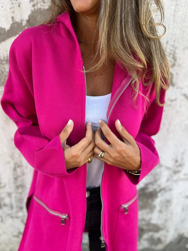 Women’s hot pink zip-up hooded cardigan close-up of zipper and front pocket zips