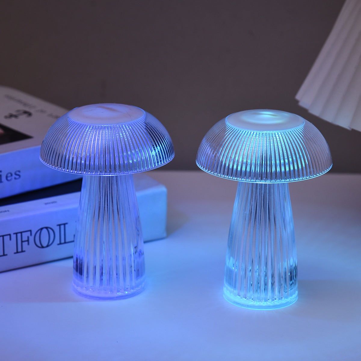 Mushroom jellyfish night light emitting blue light through ridged translucent base