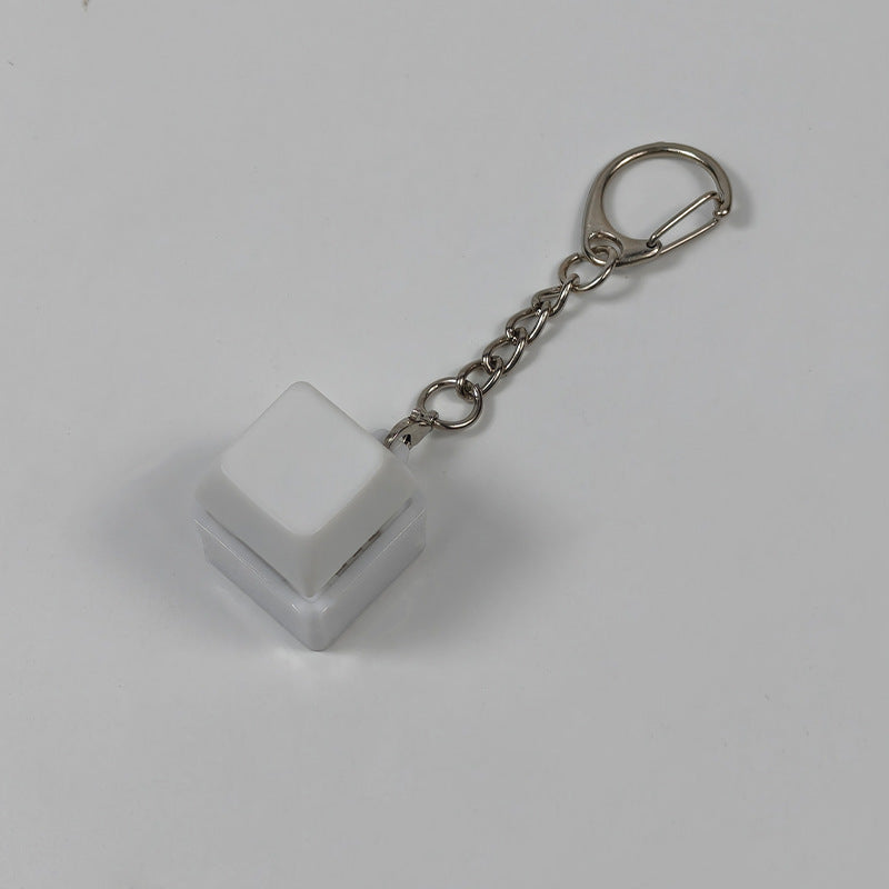 White cube stress-relief keychain toy with finger-popping button and metal chain